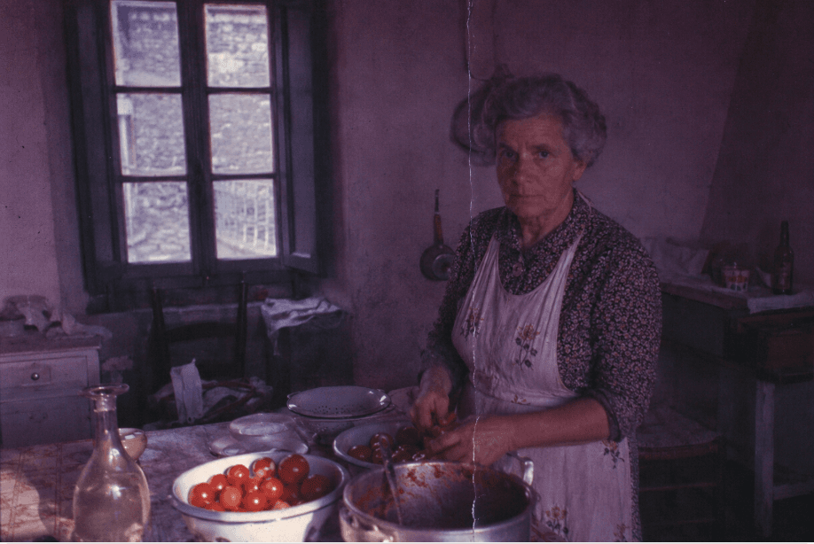A kitchen table laid for a meal, photographed on colour slide film.